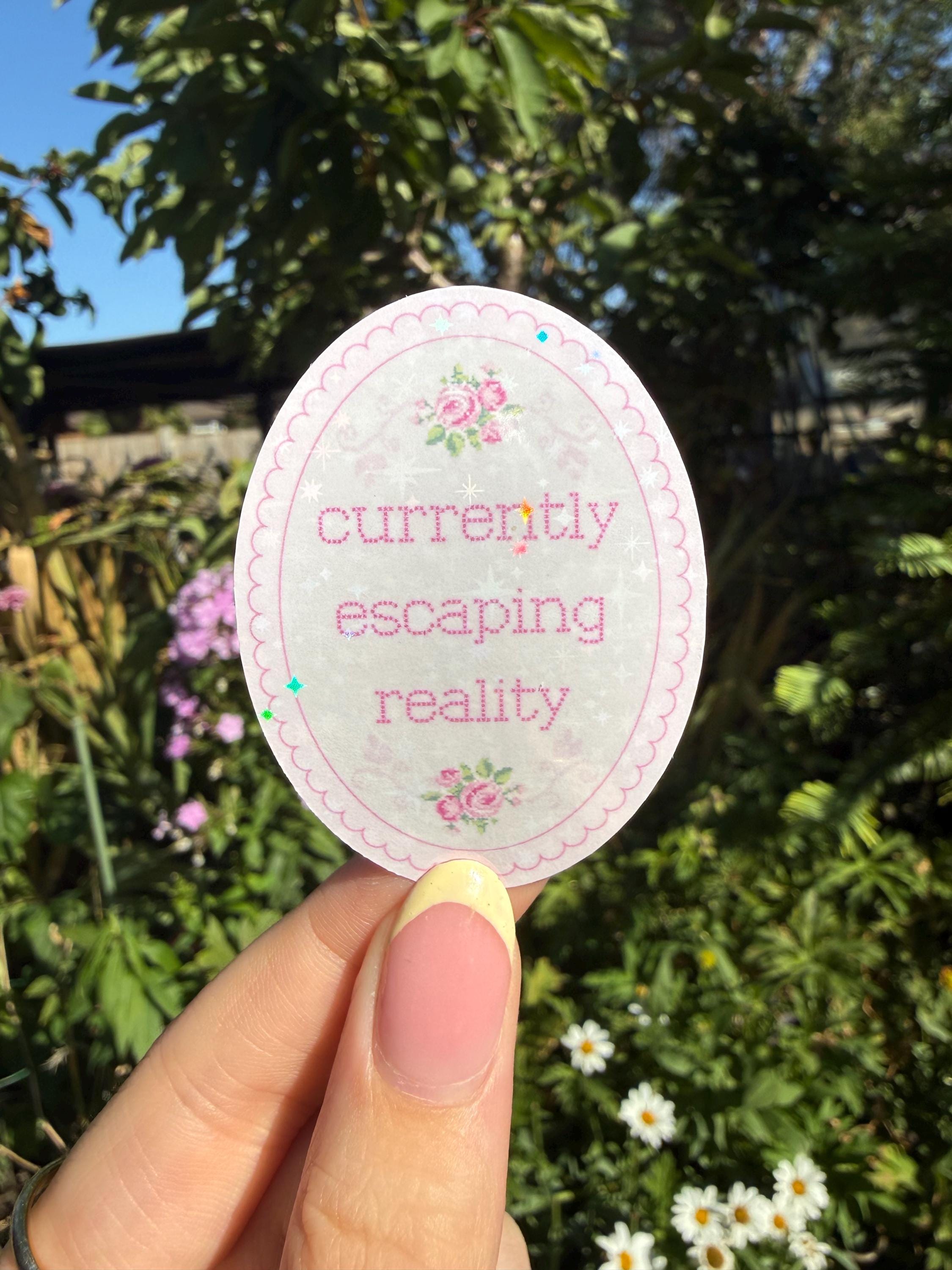 Currently Escaping Reality Cross Stitch Holographic Bookish Sticker